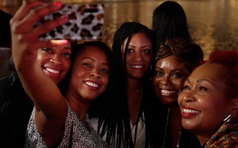 Group of women taking a selfie at the Black Enterprise Women of Power Summit in 2022
