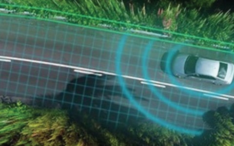 Bird's eye view of a car driving down a road. The road has gridlines and the car has circles around it.